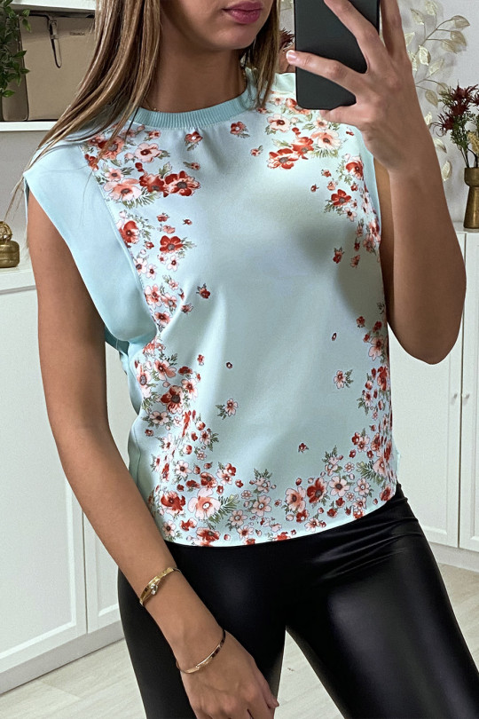 White top with flower print and visible back.