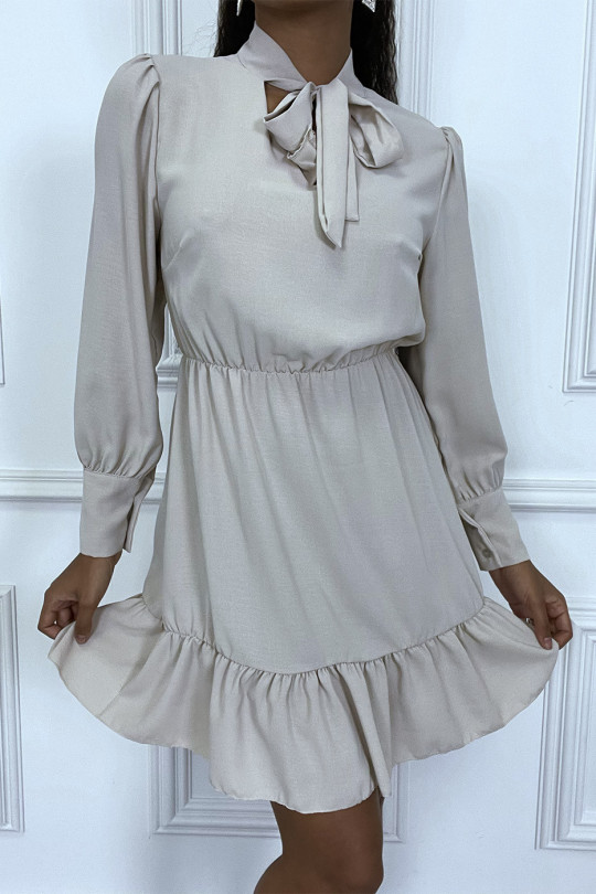 Beige skater dress with ruffle and knot at the neck - 1