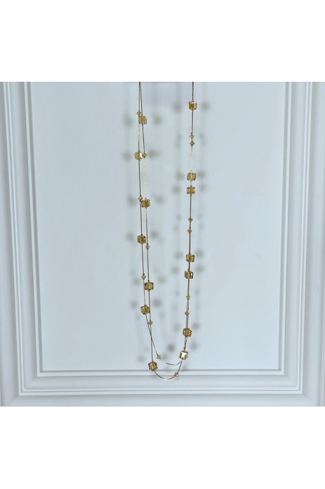 Collier sautoir doré avec pierres transparentes brillantes