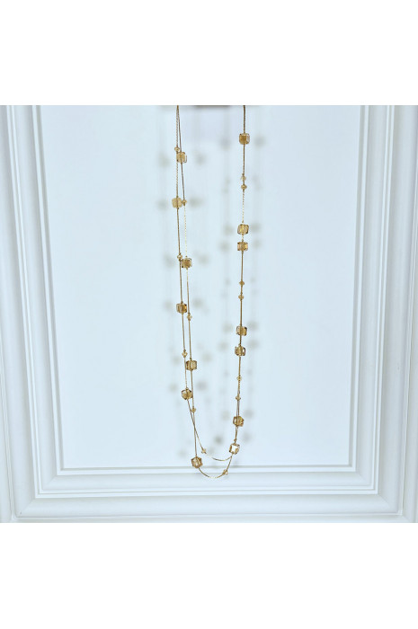 Collier sautoir doré avec pierres transparentes brillantes