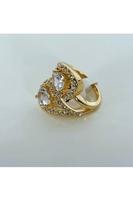 Bague brillante dorée avec pierres entremêlées