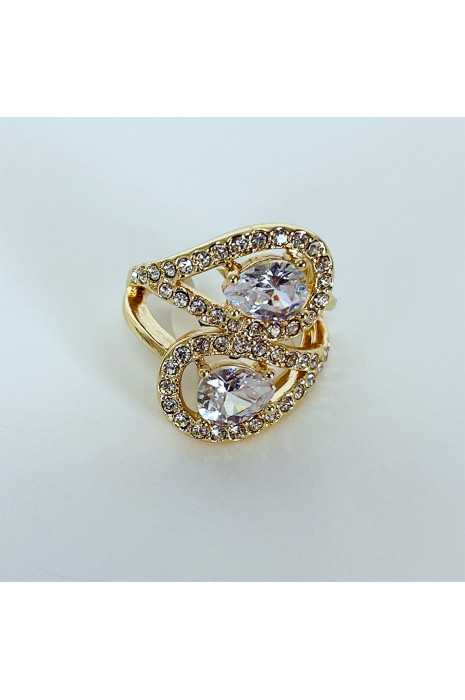 Bague brillante dorée avec pierres entremêlées