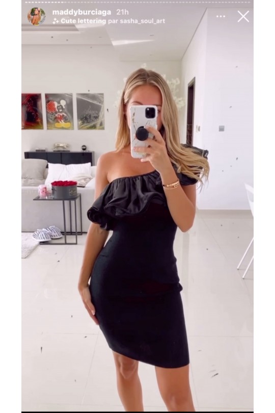 Bodycon wrap dress in black with flounce at the bust. Fashion dress
