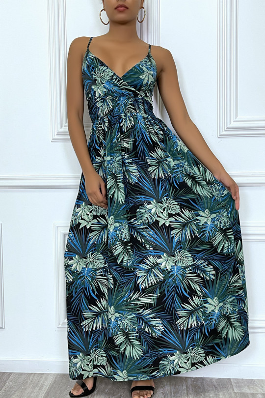 Long royal blue summer dress with tropical print and cinched at the waist.