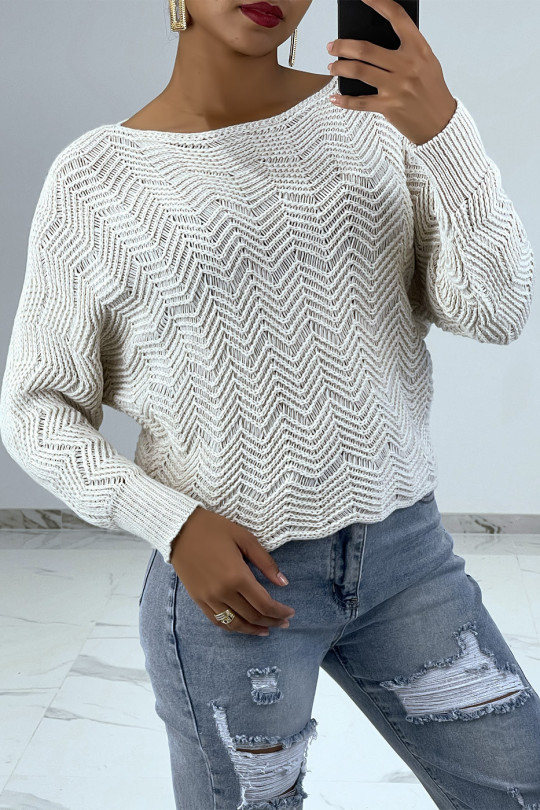 Beige sweater with batwing sleeves and knit patterns - 1