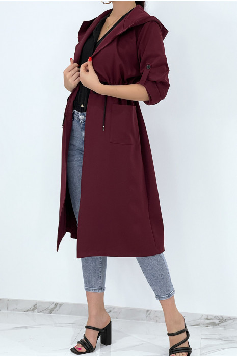 Long fluid parka style trench coat with burgundy hood to tighten at the waist