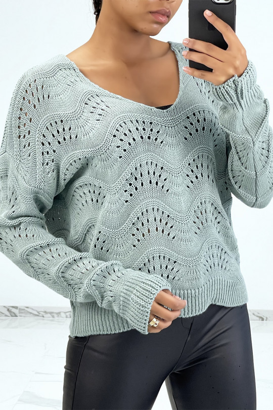 Green ribbed knit sweater with geometric patterns and oversized sleeves - 1