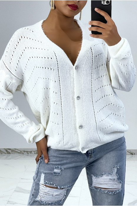 Gilet blanc composé de laine avec boutons en strass. Vêtement mode femme