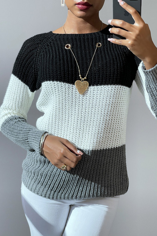 Black tricolor cable-knit sweater and star pendant necklace. - 1