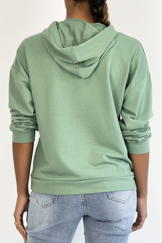 Sea green hoodie with pocket and SQUID GAMER writing - 1