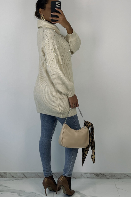 Loose beige turtleneck knit sweater dress with embossed pattern and pearls on the chest - 1