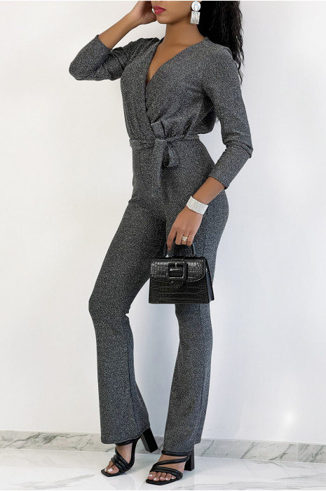 Zilverkleurige jumpsuit met overslag en wijd uitlopende broek met lovertjes - 1