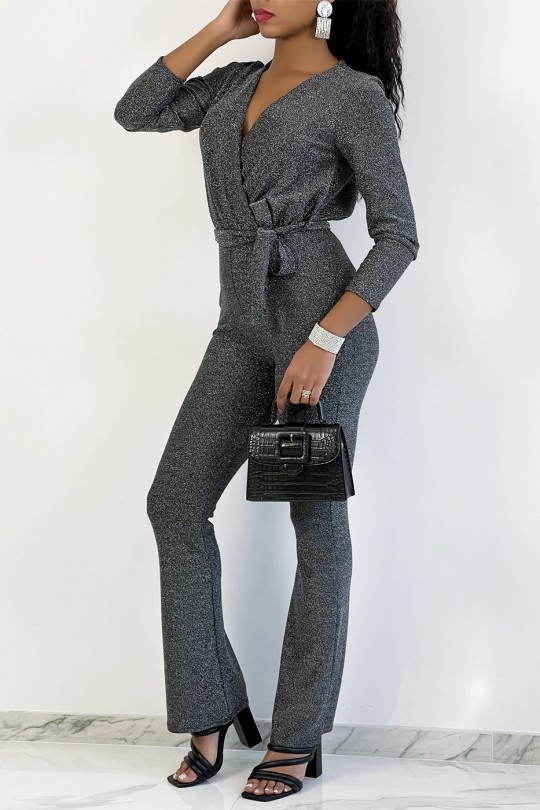 Zilverkleurige jumpsuit met overslag en wijd uitlopende broek met lovertjes - 1