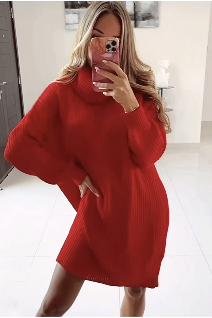 Large red knit turtleneck sweater dress with puffed sleeves.