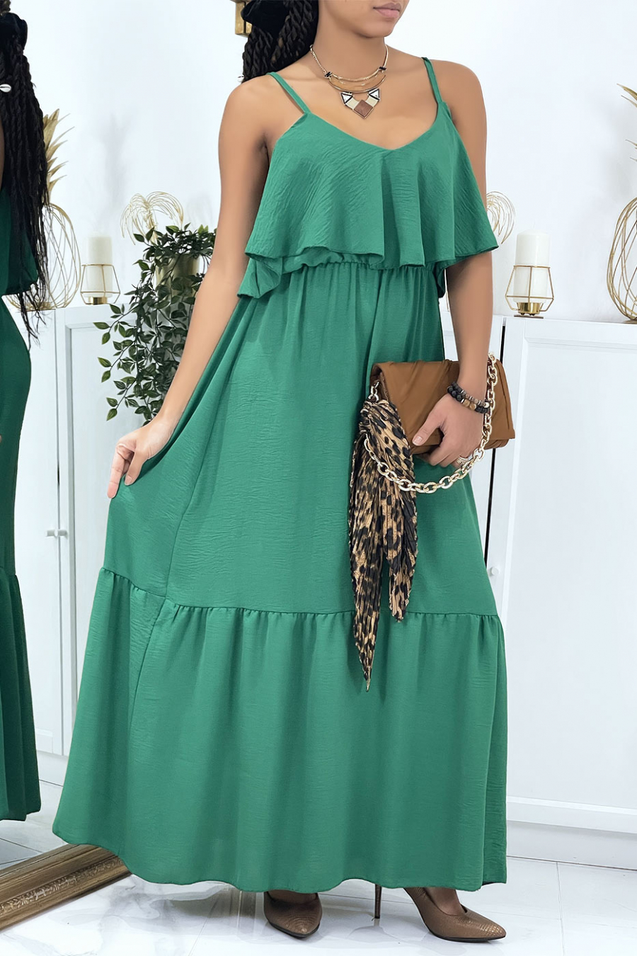 Long flared pine green dress with flounces and straps