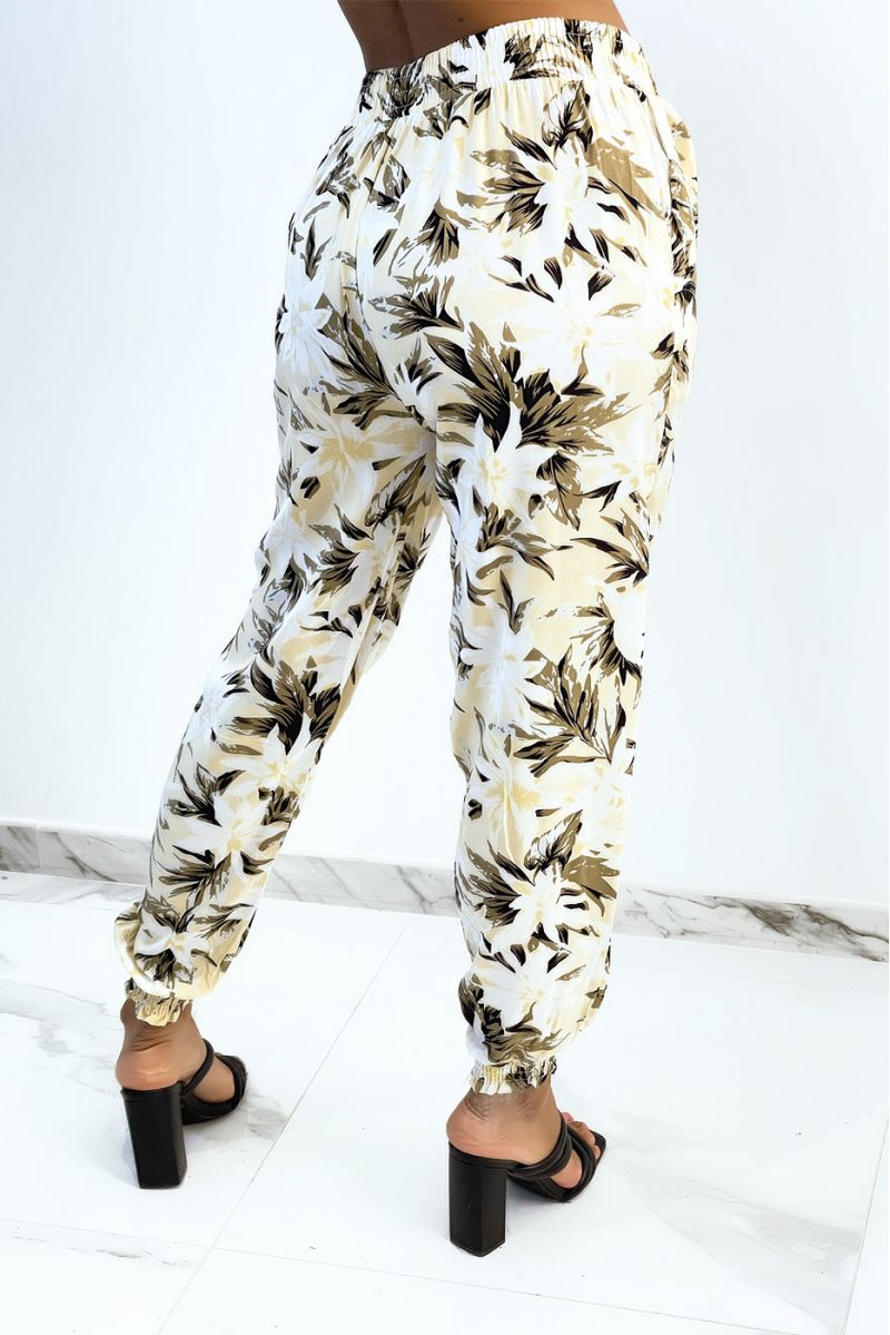 Flowing beige pants with tropical print tightened at the ankles - 3