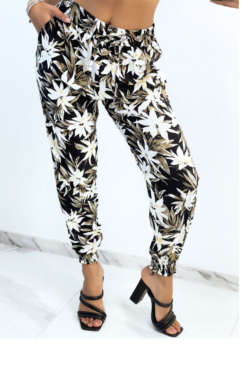 Flowing black trousers with tropical print tightened at the ankles - 2