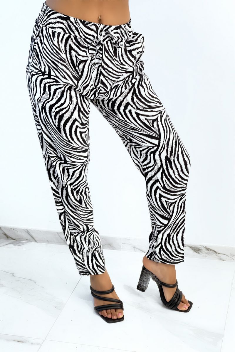 Flowing white straight-cut trousers with zebra print tightened at the ankles - 4
