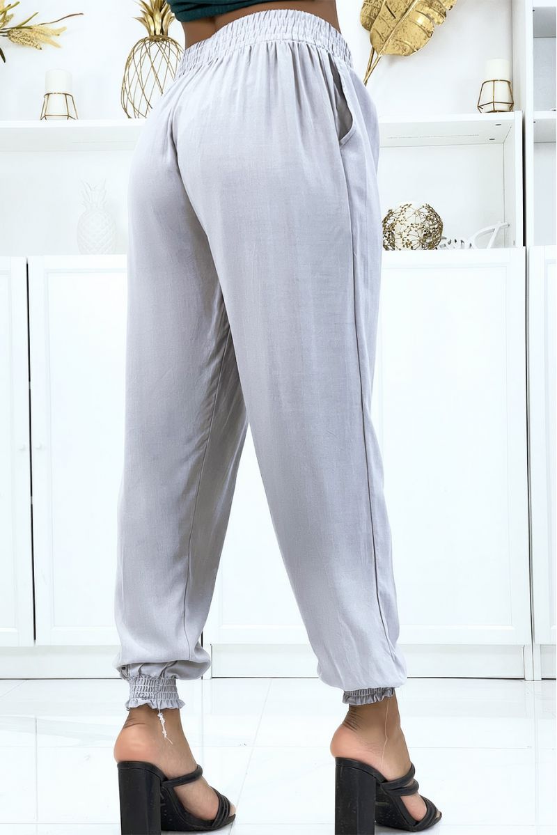 Soepelvallende grijze broek met elastische taille en enkels - 3