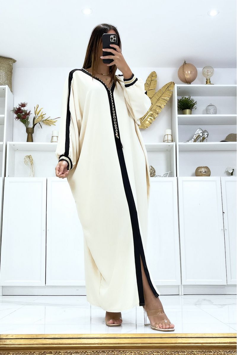 Beige abaya with black edging and gold cord at the collar - 1