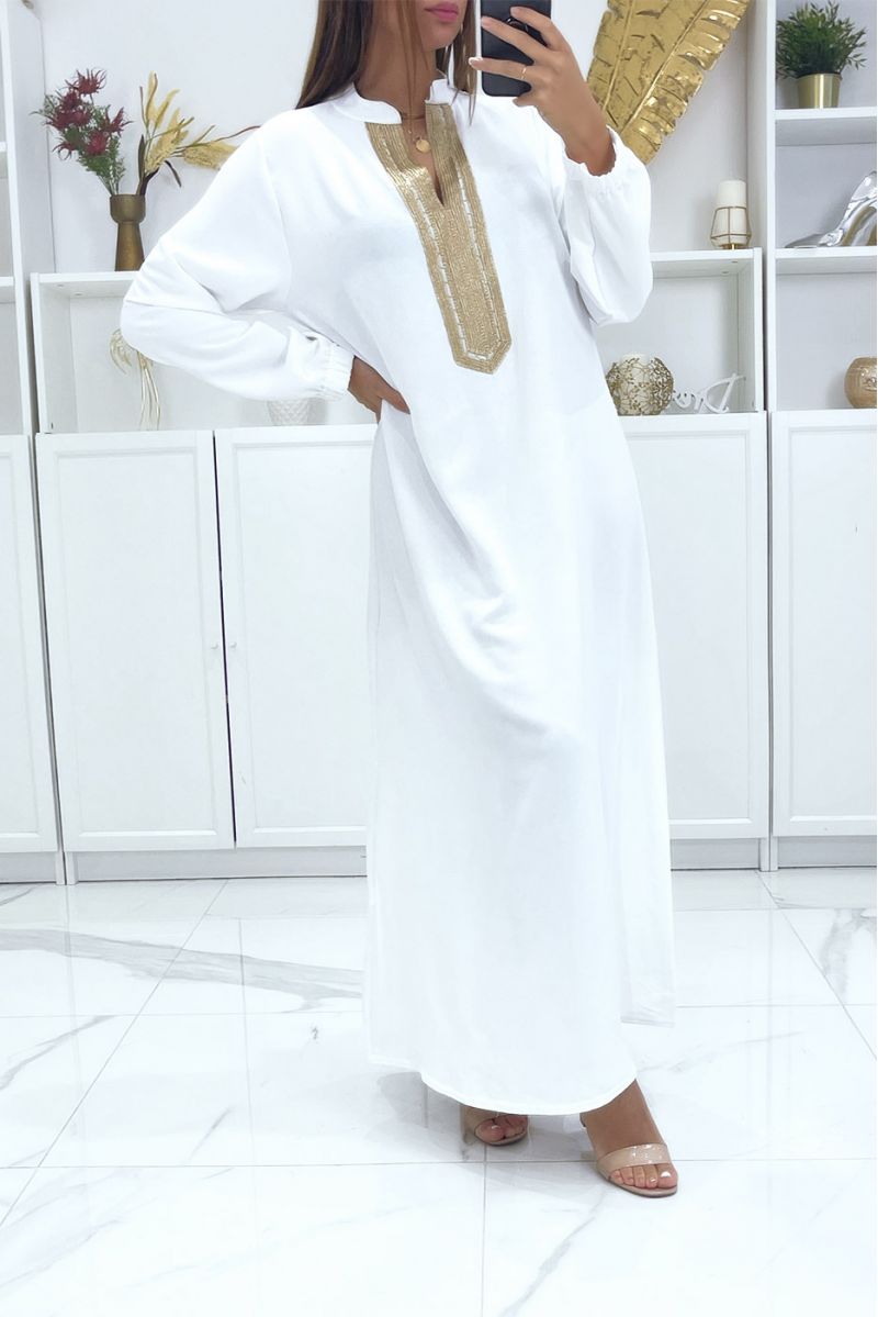 Black abaya with beige piping and gold cord at the collar