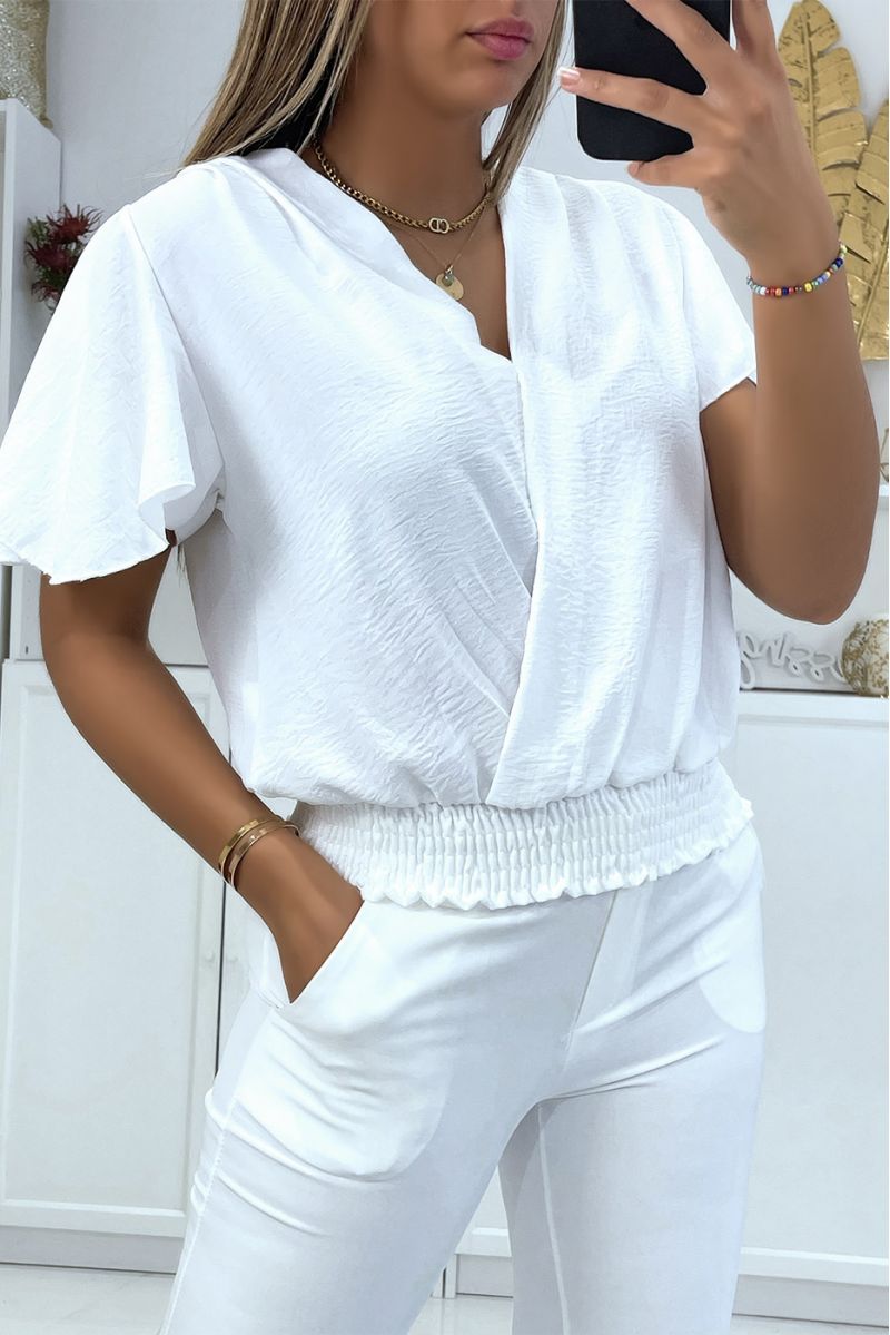 Flowing white wrap top, fitted at the lower abdomen - 1
