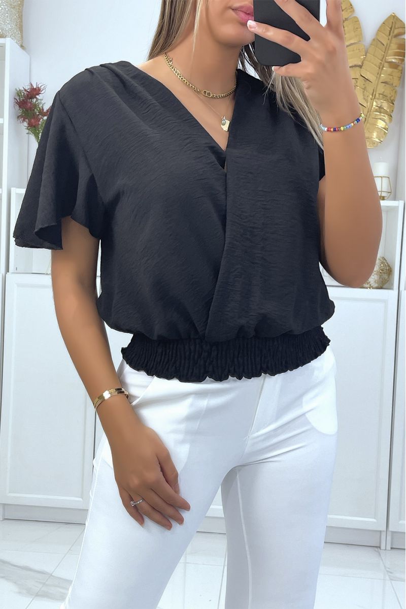 Flowing black wrap top, fitted at the lower abdomen - 1