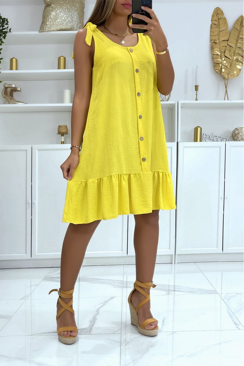 Mooie losse gele jurk met knopen en brede bandjes die strikken - 1