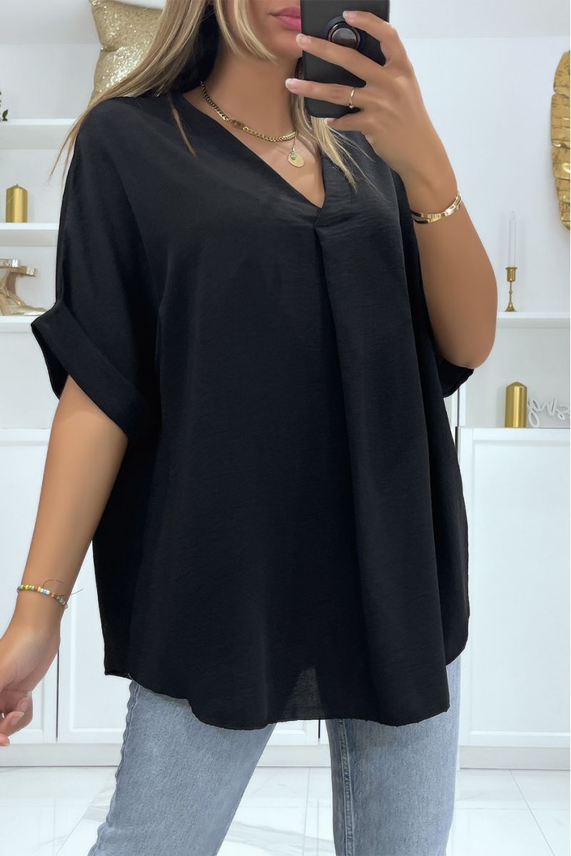 Solid color black oversized top with V-neck and batwing effect sleeves - 1