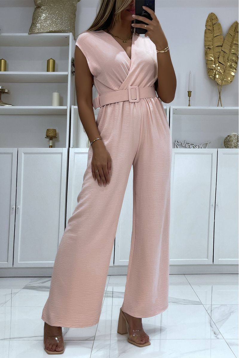 Pink belted jumpsuit with flared pants and wrap effect top - 1