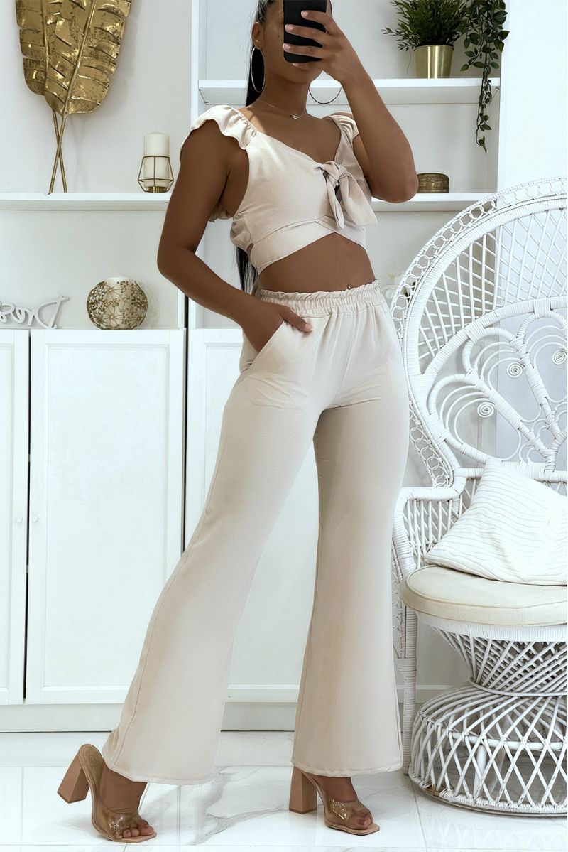Beige soepelvallende broekset met elastische olifantenpoot in de taille en crop top die op de rug gestrikt kan worden - 3