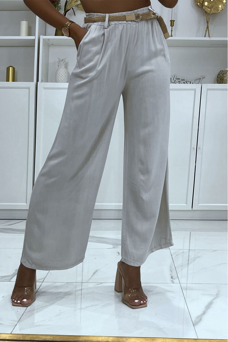 Beige palazzo pants with thin straw belt, cinched at the waist - 1