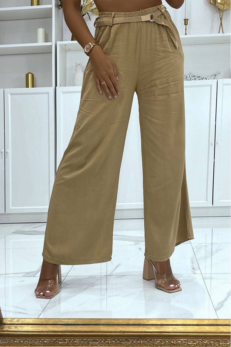Camel palazzo pants with thin straw belt cinched at the waist - 1
