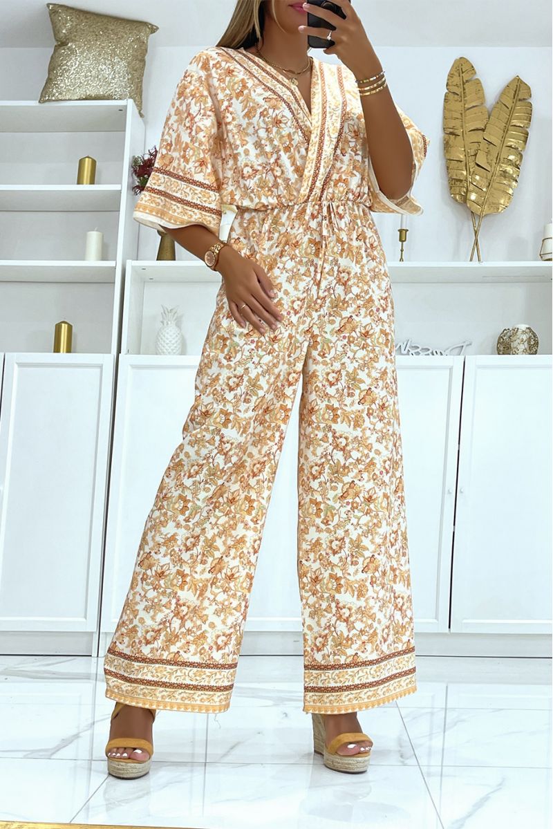 Beige and white bell bottom jumpsuit fitted at the waist with beautiful floral print - 1