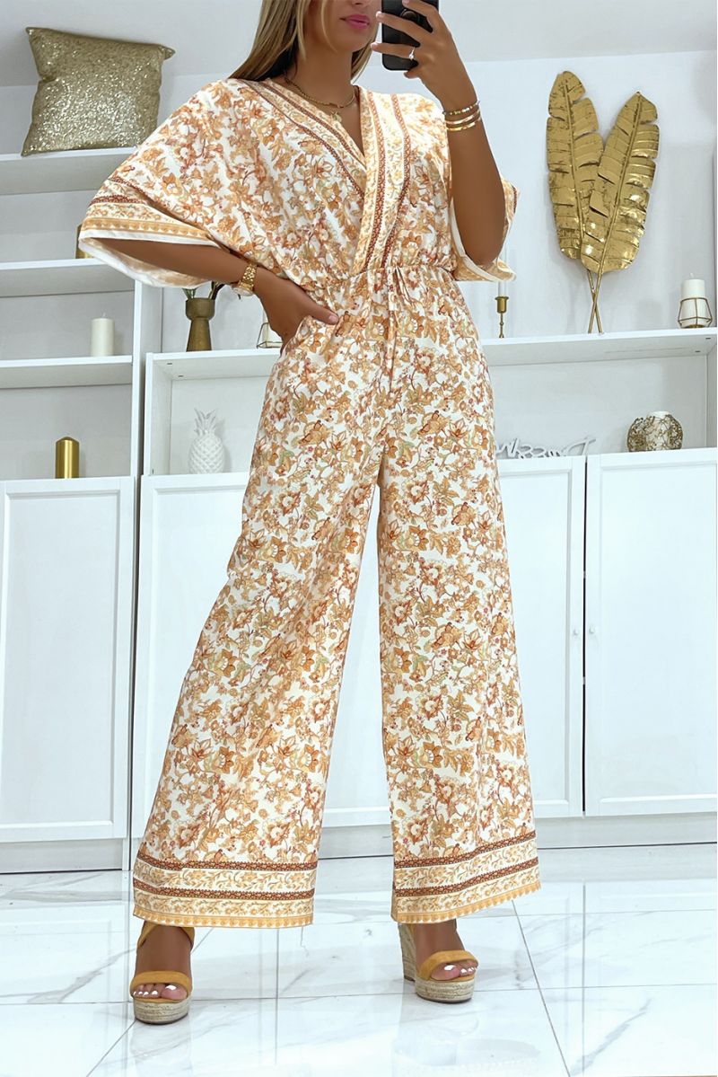 Beige and white bell bottom jumpsuit fitted at the waist with beautiful floral print - 2