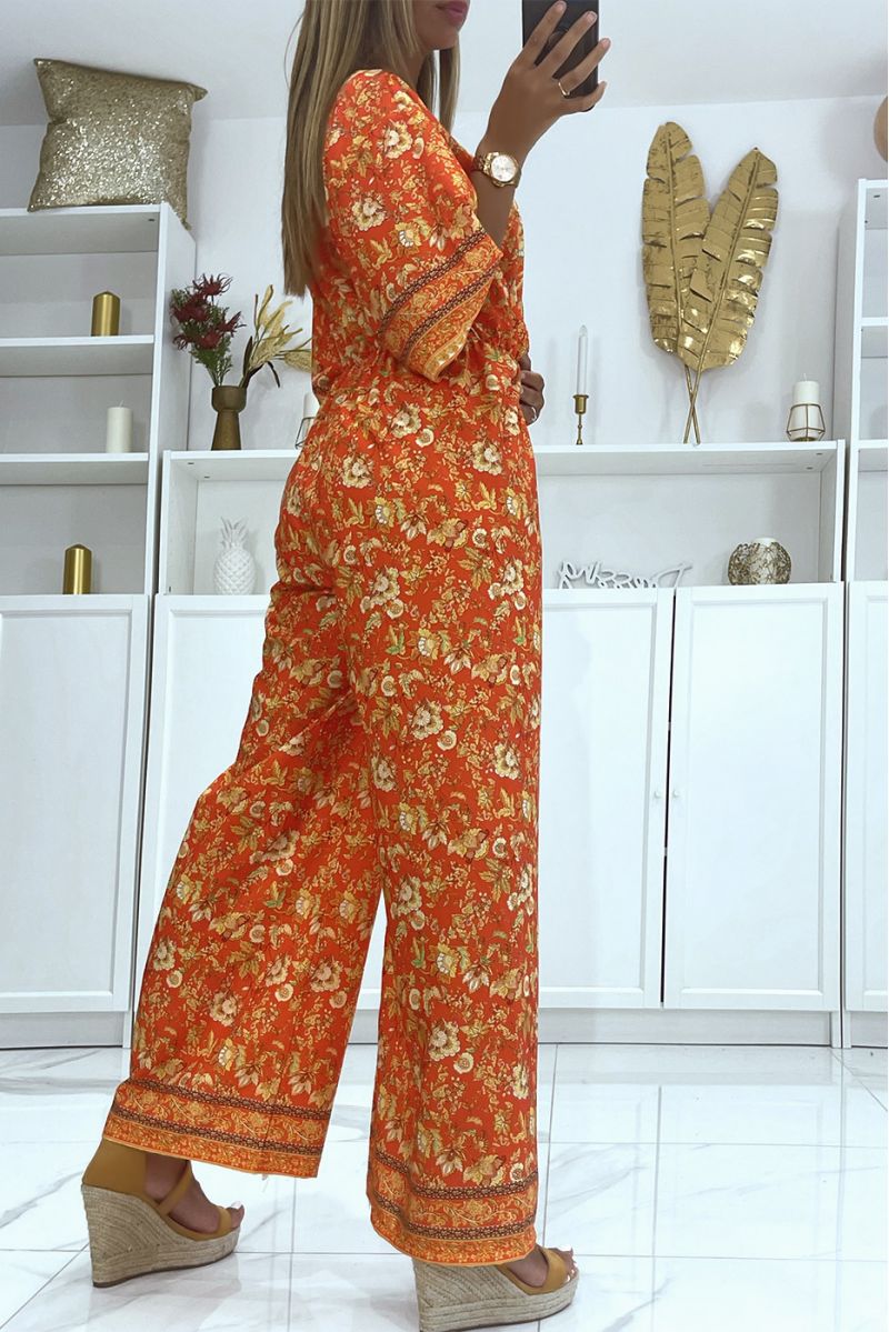 Red bell bottom jumpsuit fitted at the waist with beautiful floral print - 4