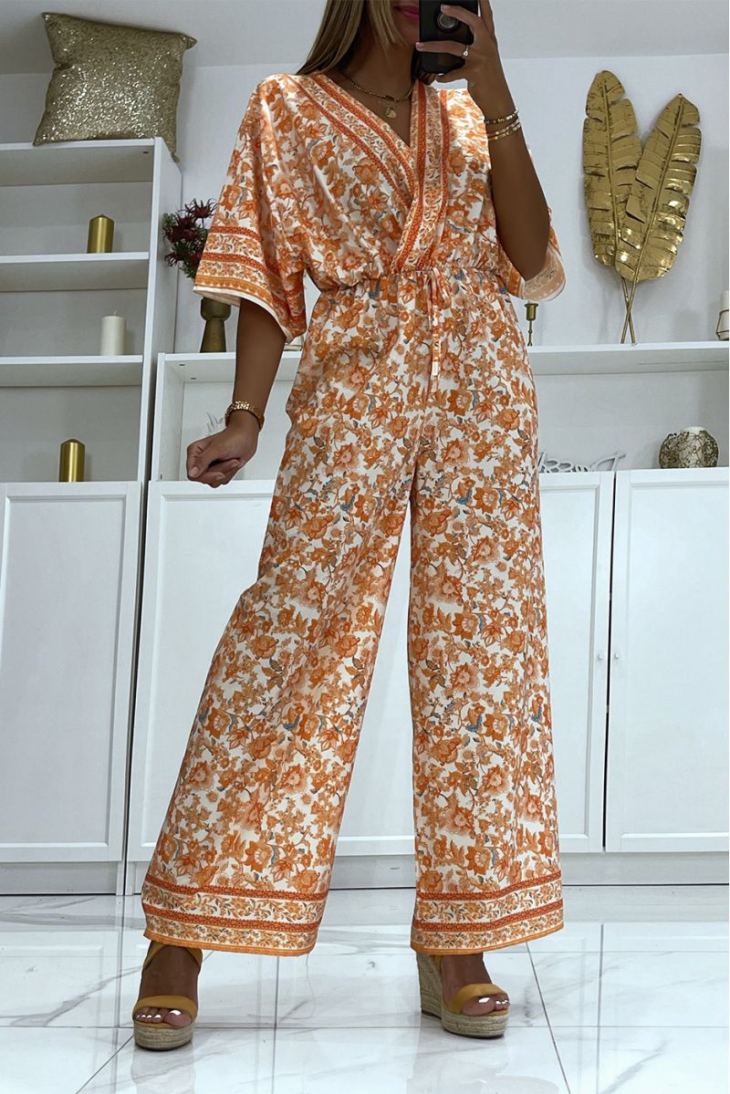 Oranje bell bottom jumpsuit getailleerd in de taille met mooie bloemenprint - 2