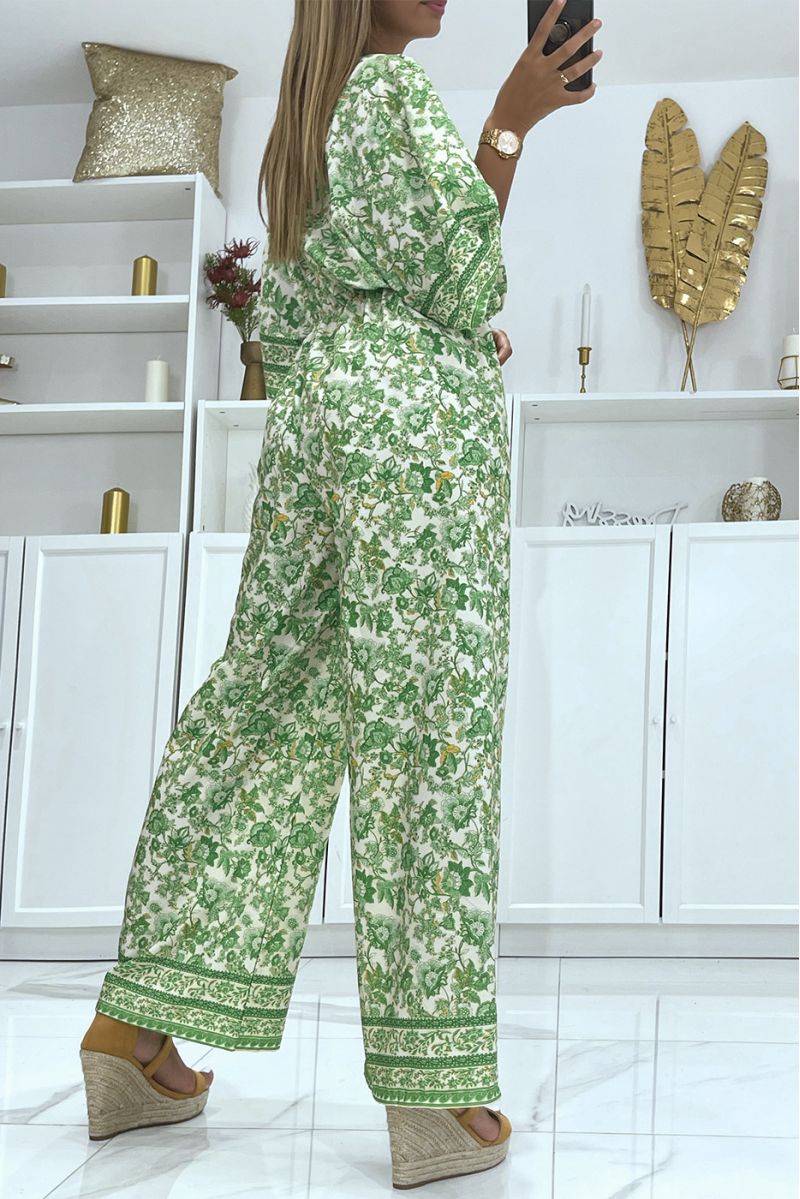 Groen met witte bell bottom jumpsuit getailleerd in de taille met mooie bloemenprint - 4