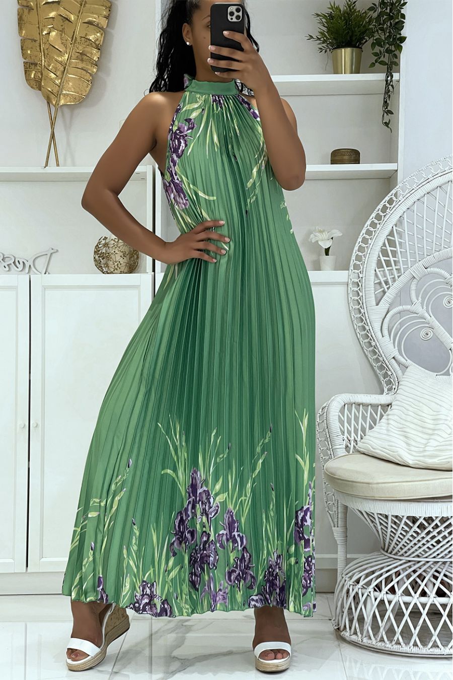 Long pleated green satin dress with floral pattern and high neck