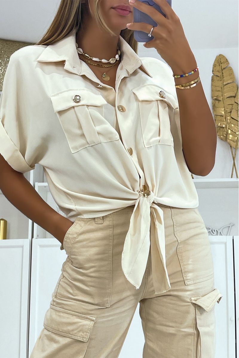 Korte beige zwarte blouse die in de taille strikt met korte mouw zakken en mooie gouden knopen - 1