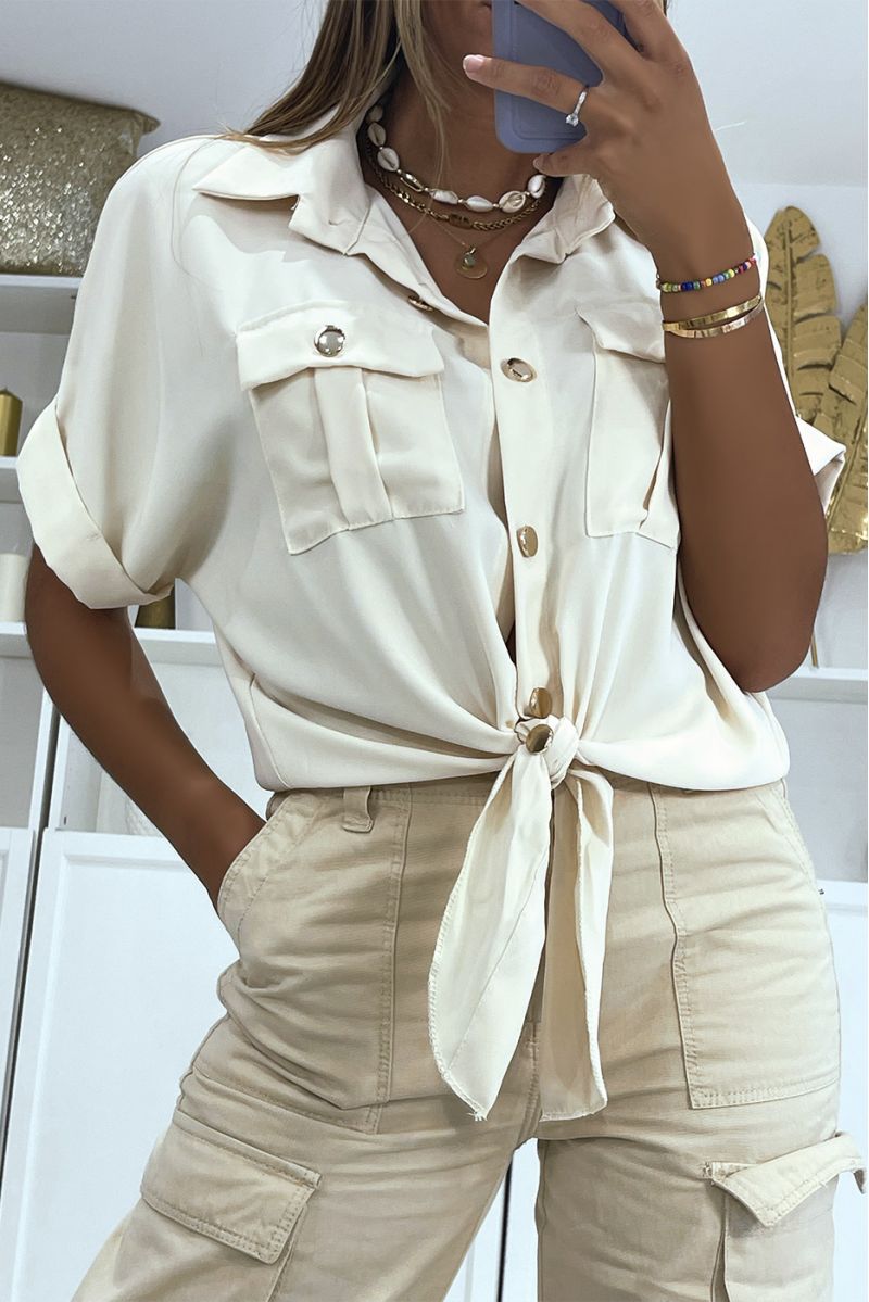 Korte beige zwarte blouse die in de taille strikt met korte mouw zakken en mooie gouden knopen - 3
