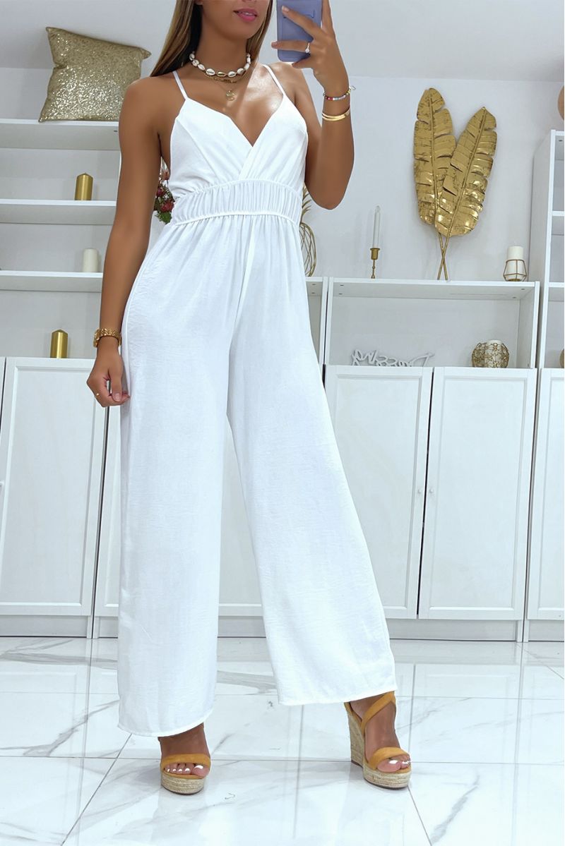 White bell bottom jumpsuit with slight neckline, thin straps and fitted at the waist - 2
