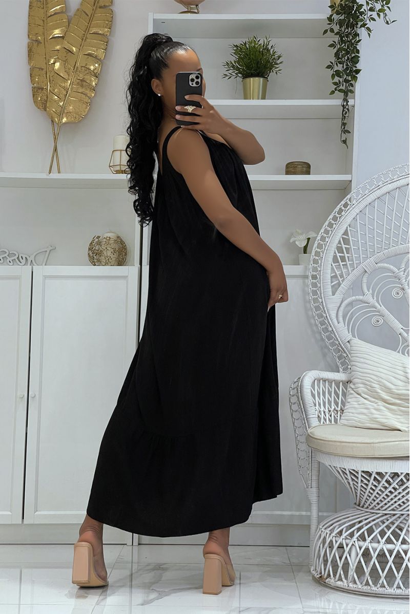 Long oversized black dress with wide straps and openwork at the collar with ruffles in bah - 4