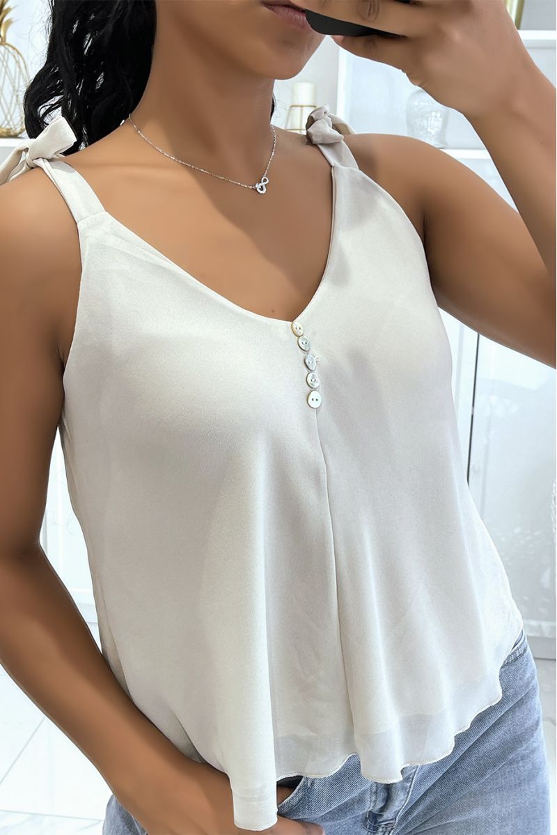 Beige tanktop met strik op de bandjes en kleine knoopjes op de borst - 1 Beige tanktop met strik op de bandjes en kleine knoopjes op de borst - 1
