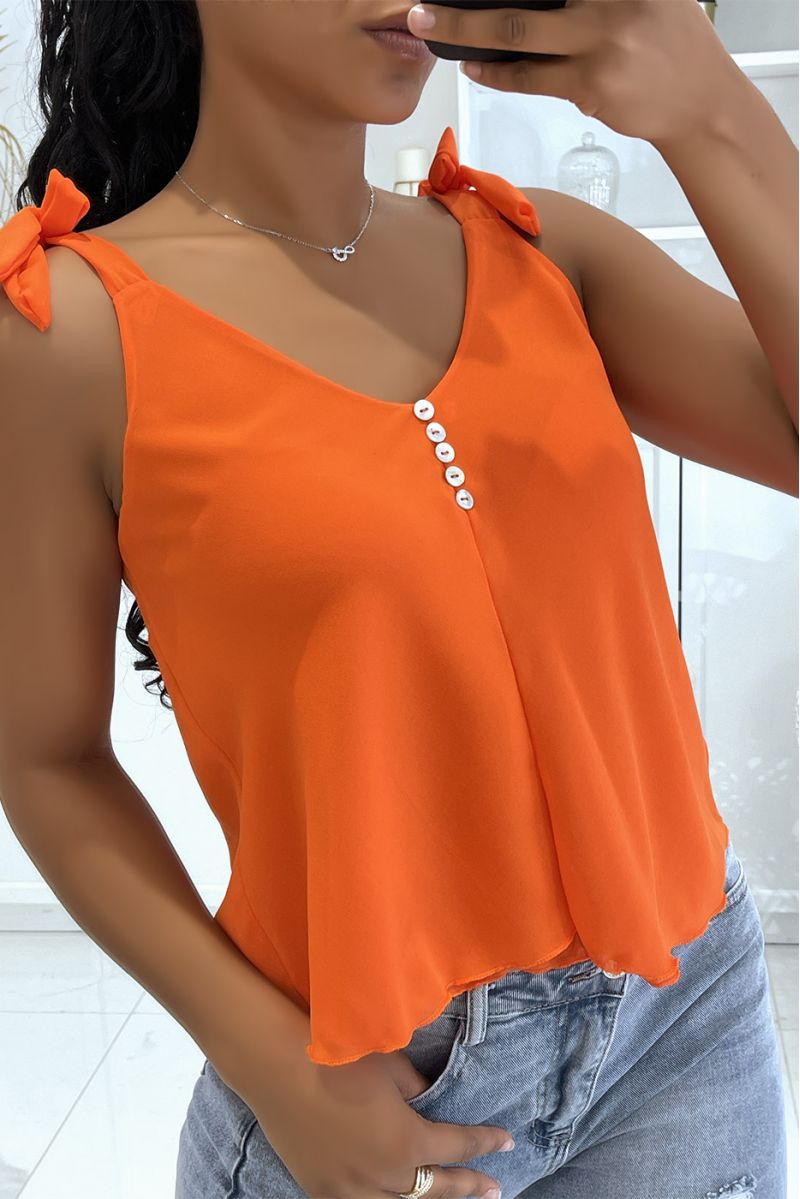 Oranje tanktop met strik op de bandjes en kleine knoopjes op de borst - 1