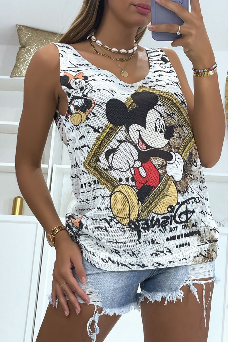 Ecru V-neck knit tank top with mickey print in front of a gold painting - 1