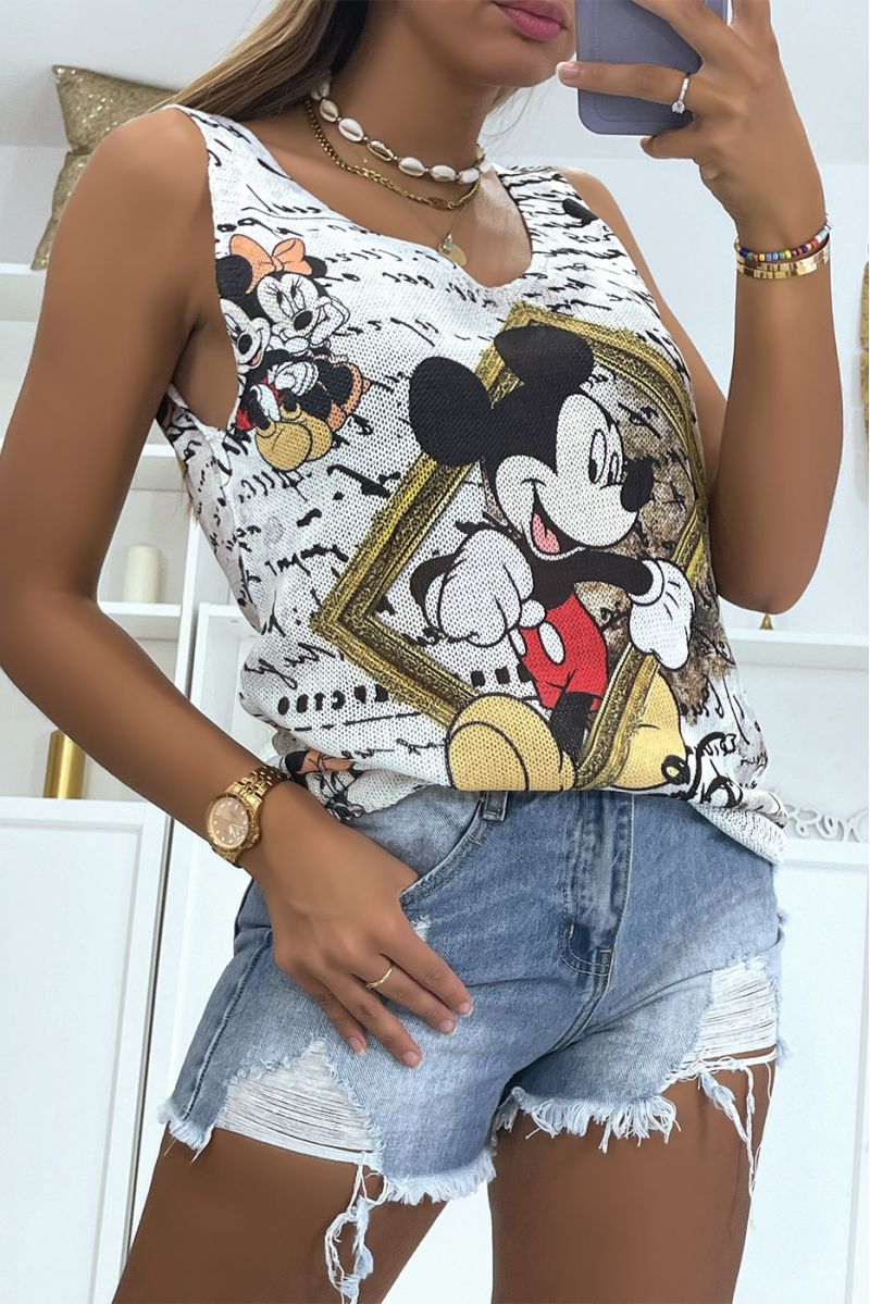 Ecru V-neck knit tank top with mickey print in front of a gold painting - 3