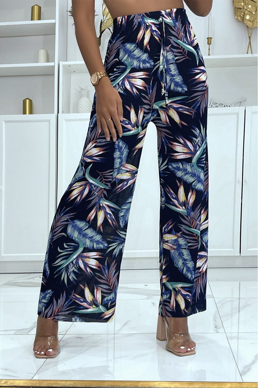 Navy bell bottom pants with floral print and foliage fitted at the waist  - 1