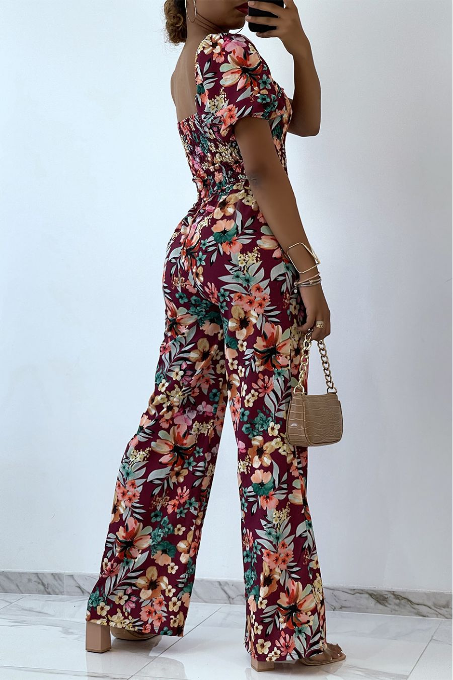 Floral burgundy jumpsuit with bell bottoms and strapless top with elastic chest essential for summer