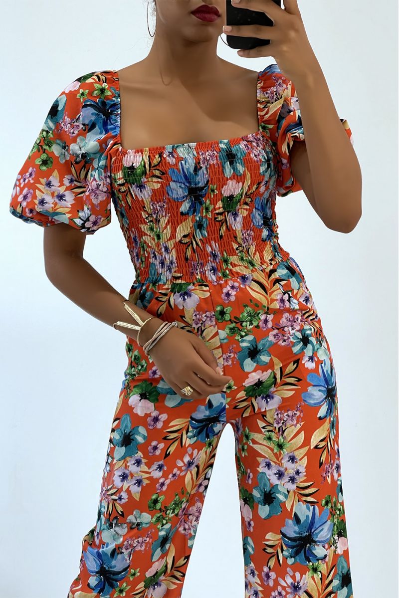 Gebloemde oranje jumpsuit met bell bottoms en strapless top met elastische borst, essentieel voor de zomer - 3